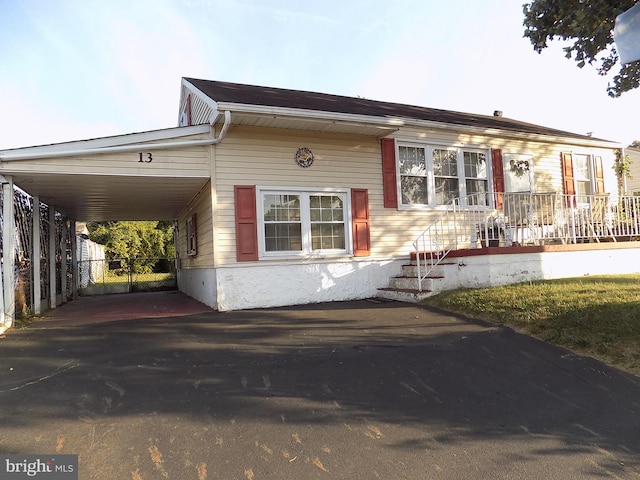 view of front of property featuring a carport