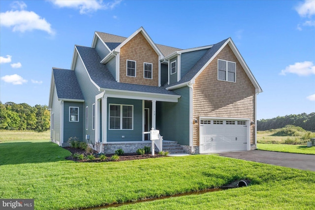 73 King Richard Rd, Berlin, MD 21811 - craftsman-style house with a front lawn, driveway, and a shingled roof
