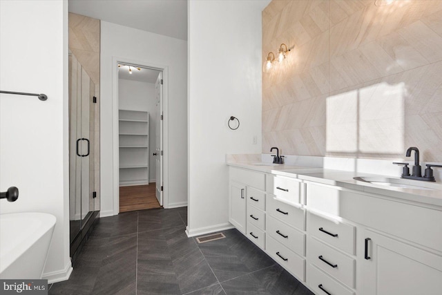 73 King Richard Rd, Berlin, MD 21811 - full bathroom featuring a shower stall, double vanity, visible vents, and a sink