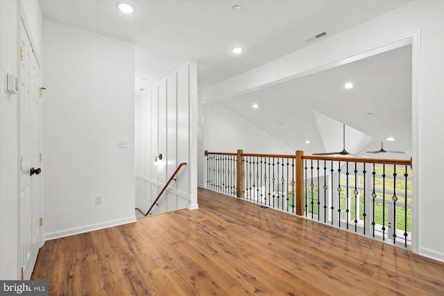 73 King Richard Rd, Berlin, MD 21811 - hallway featuring lofted ceiling, an upstairs landing, wood finished floors, and recessed lighting