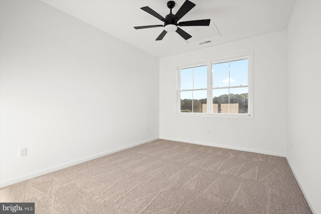 unfurnished room with ceiling fan and light colored carpet