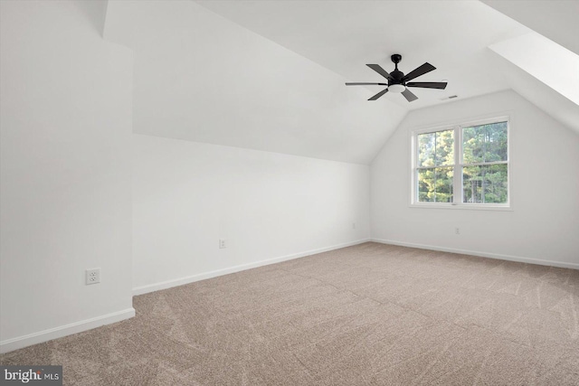 bonus room with ceiling fan, carpet floors, and lofted ceiling