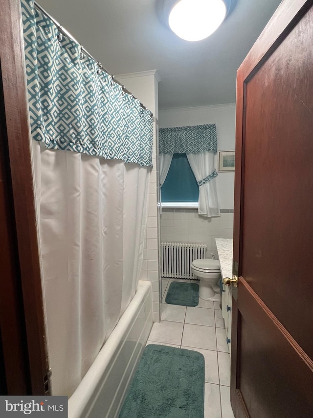 full bathroom with tile walls, shower / bathtub combination with curtain, tile patterned floors, radiator heating unit, and toilet