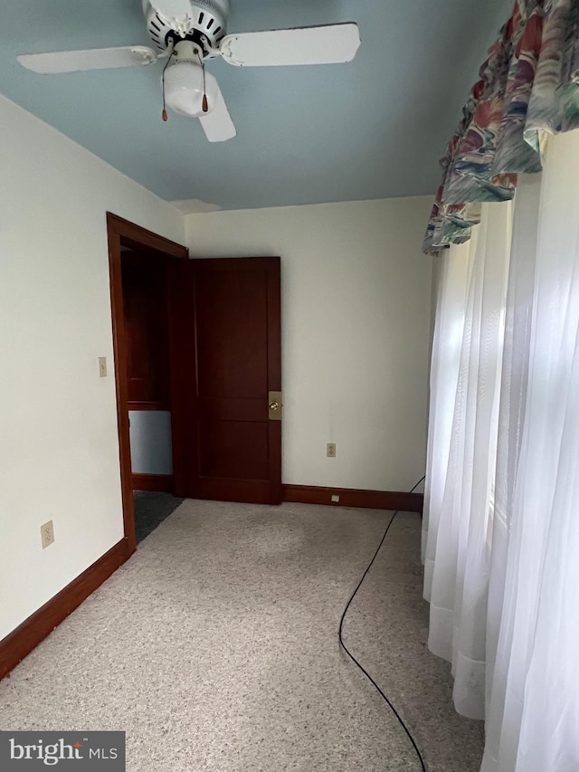 spare room with ceiling fan