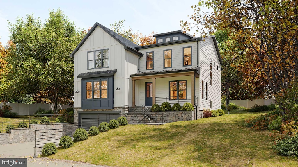 view of front of home featuring a front lawn and covered porch