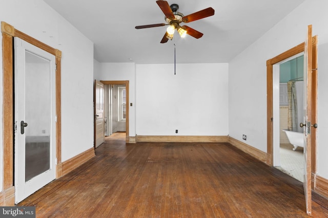 unfurnished bedroom featuring connected bathroom, ceiling fan, and dark hardwood / wood-style flooring