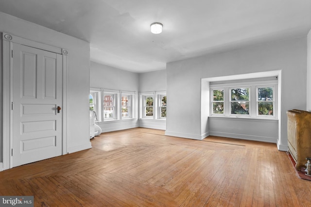 unfurnished living room with light hardwood / wood-style flooring