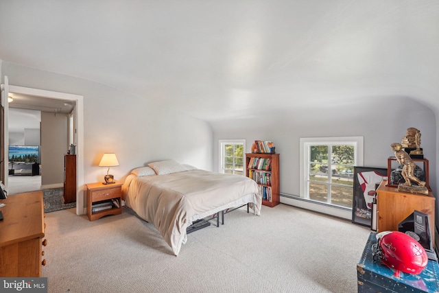 bedroom with multiple windows, carpet, and baseboard heating