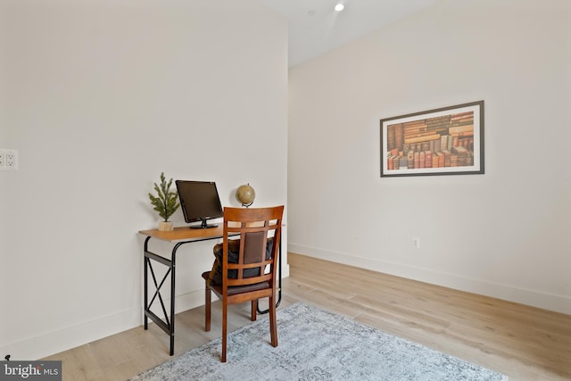 office with light wood-type flooring