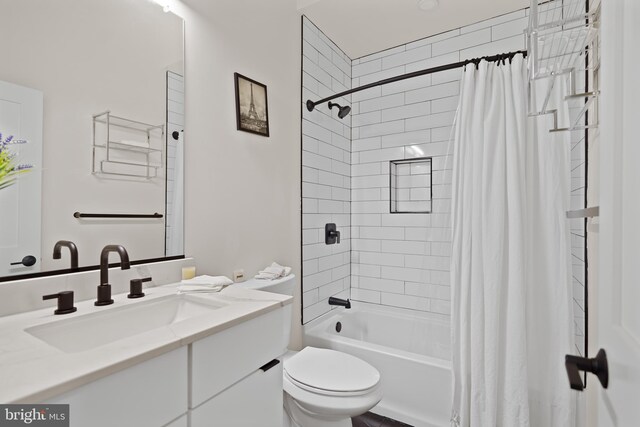 full bathroom with vanity, toilet, and shower / bath combination with curtain