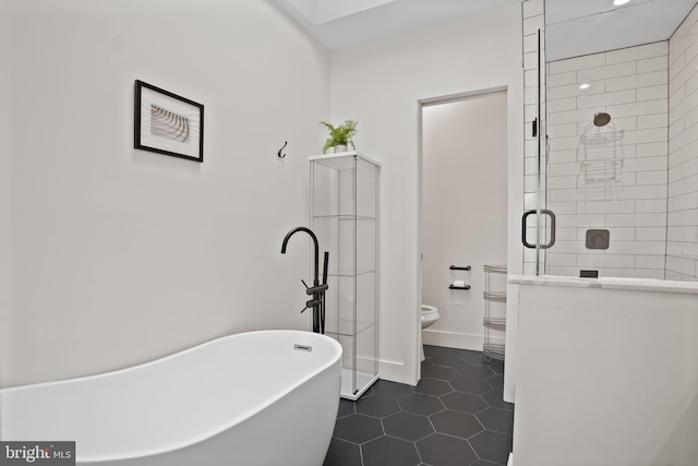 bathroom featuring shower with separate bathtub, tile patterned flooring, and toilet