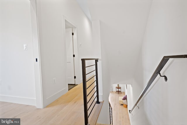 staircase featuring hardwood / wood-style flooring