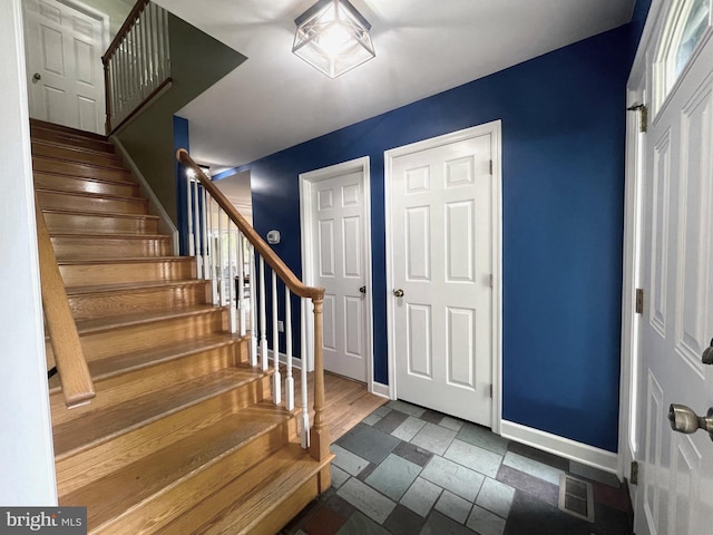 foyer entrance featuring dark hardwood / wood-style flooring