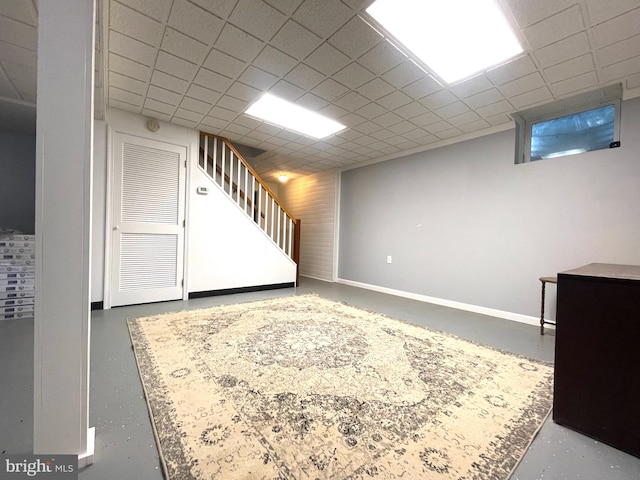 basement featuring a drop ceiling