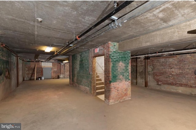 basement with brick wall