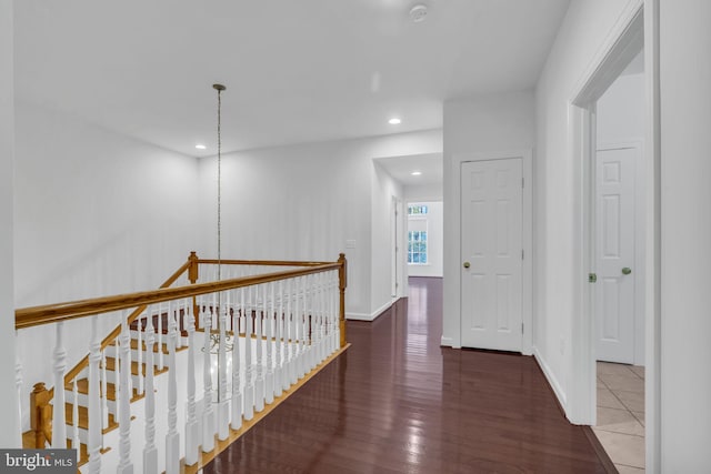 corridor with dark hardwood / wood-style floors