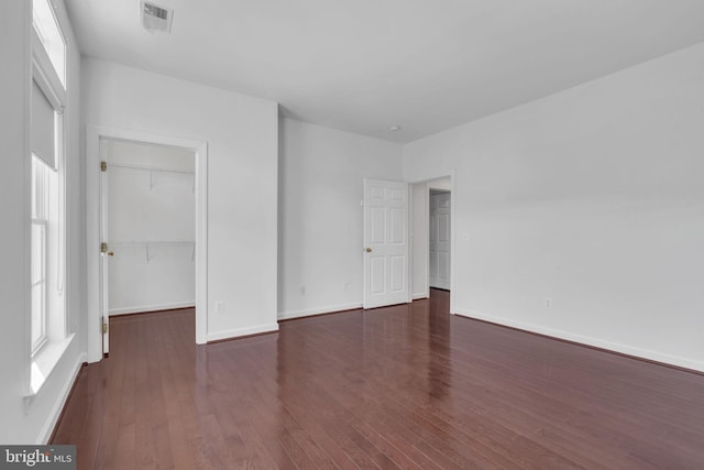 spare room featuring dark hardwood / wood-style flooring