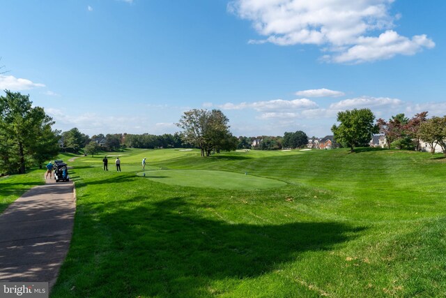 view of property's community featuring a lawn