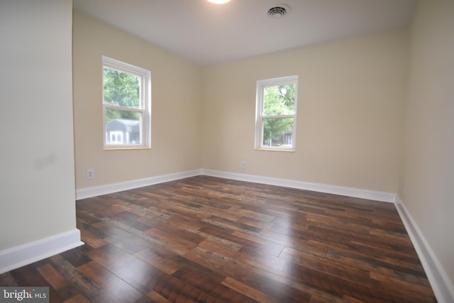 104 School Ln, Georgetown, DE 19947 - unfurnished room featuring visible vents, dark wood finished floors, and a wealth of natural light