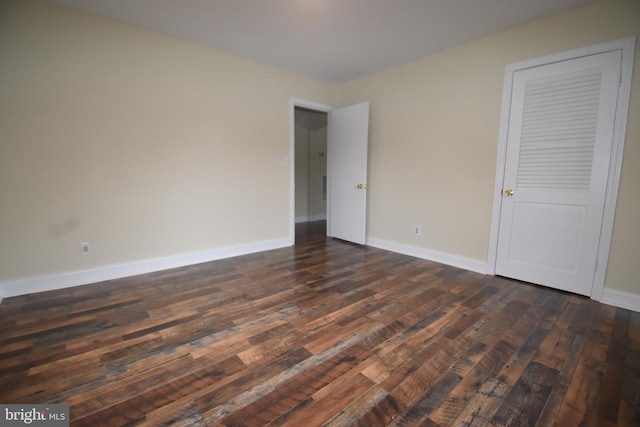 104 School Ln, Georgetown, DE 19947 - unfurnished bedroom featuring dark wood-style flooring and baseboards