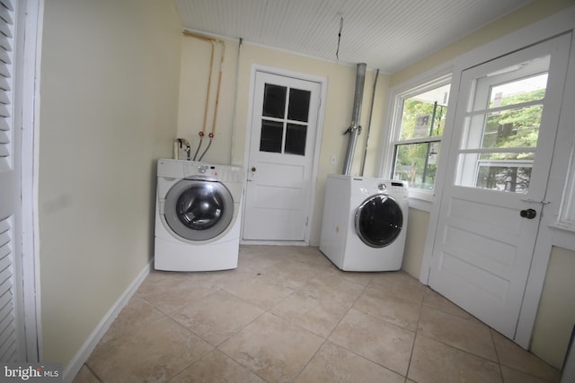 104 School Ln, Georgetown, DE 19947 - laundry area featuring light tile patterned floors, baseboards, laundry area, and washing machine and dryer
