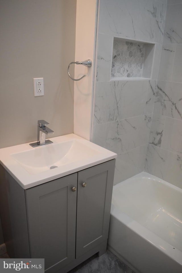 bathroom featuring a bathing tub and vanity