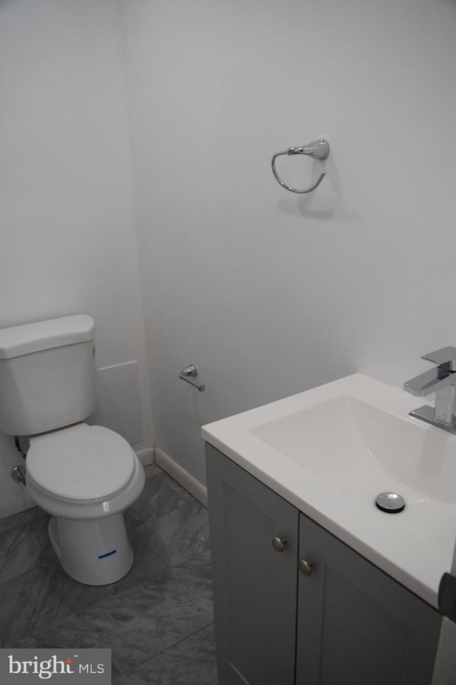 bathroom with vanity and toilet