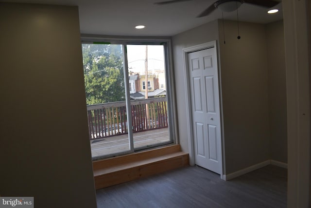 interior space featuring dark hardwood / wood-style flooring and ceiling fan