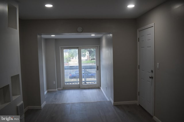 entryway with dark hardwood / wood-style floors