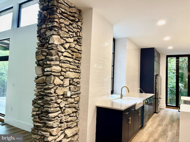 bathroom featuring wood-type flooring and sink