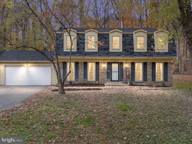 view of front facade with a garage and a porch