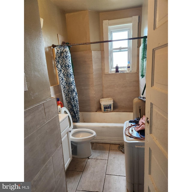 bathroom featuring shower / tub combo, toilet, and tile patterned flooring