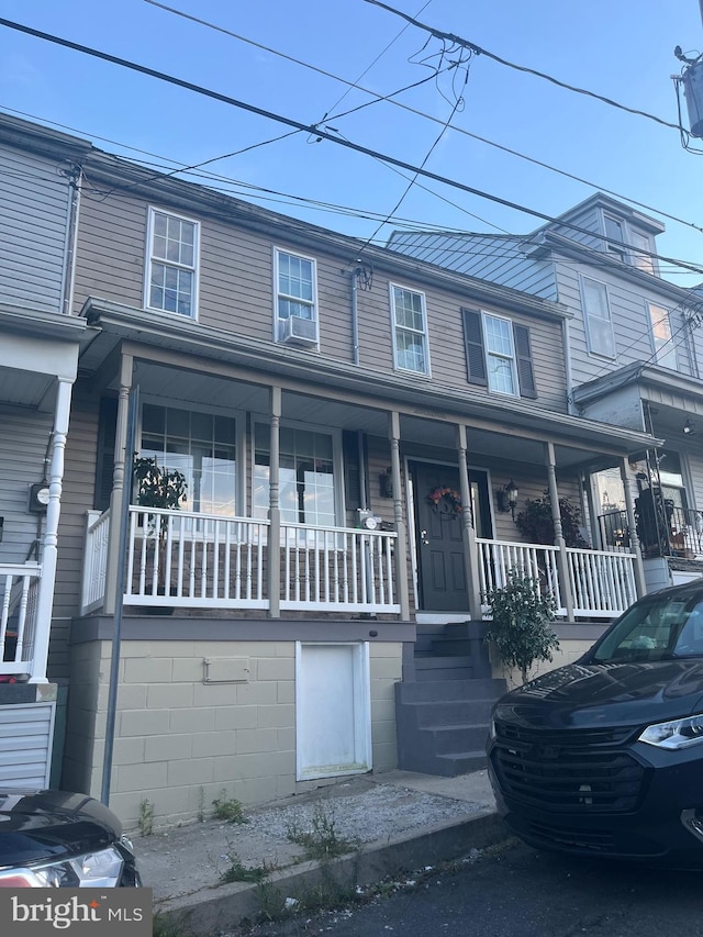 multi unit property featuring a porch