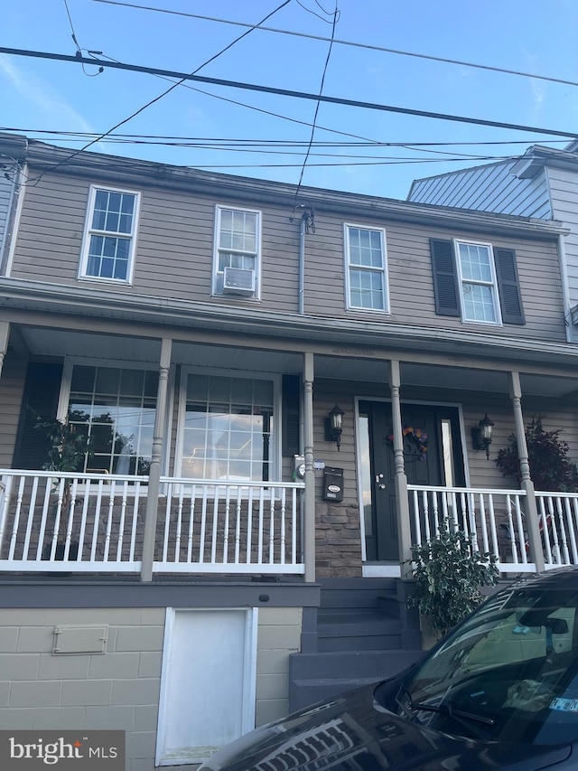 multi unit property featuring a porch