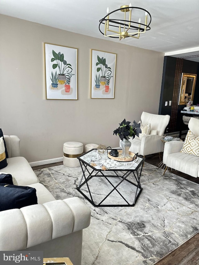 living room featuring a notable chandelier and hardwood / wood-style flooring