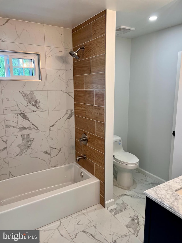 full bathroom featuring marble finish floor, shower / bathing tub combination, vanity, and toilet