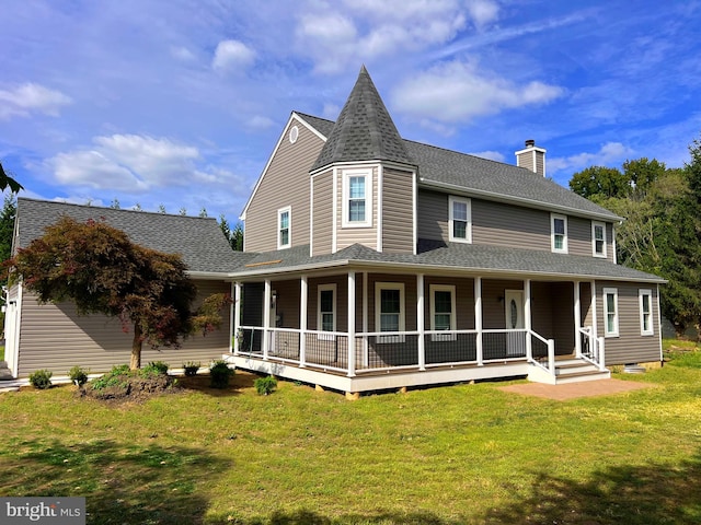 back of house featuring a yard and covered porch