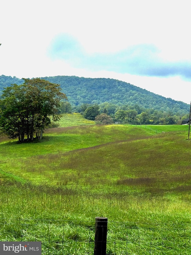 mountain view featuring a rural view