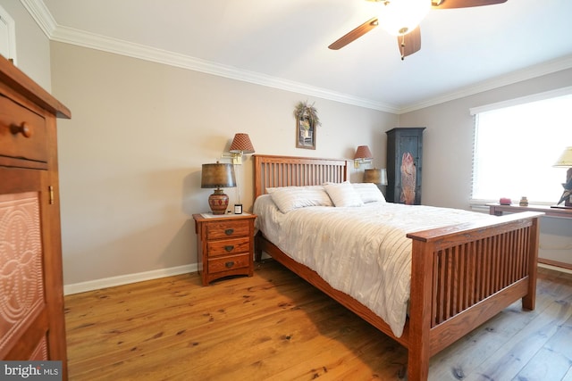 bedroom featuring ornamental molding, ceiling fan, and light hardwood / wood-style flooring