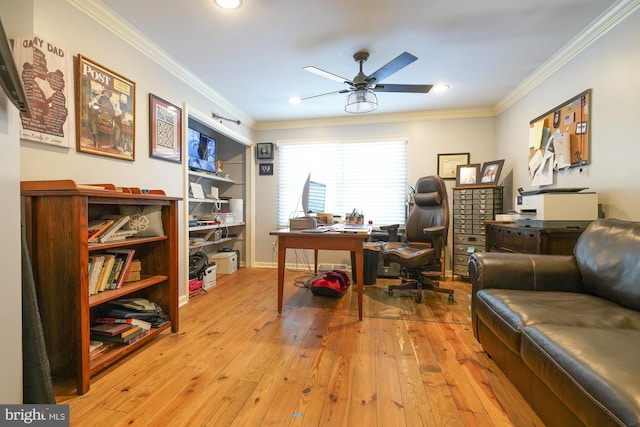 office with ceiling fan, crown molding, and light hardwood / wood-style floors