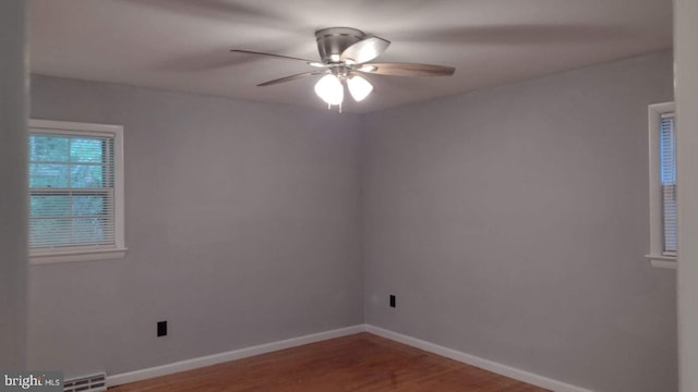 unfurnished room featuring hardwood / wood-style flooring and ceiling fan