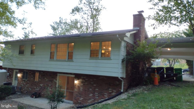 view of side of home featuring a carport