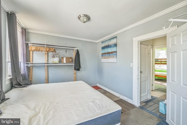 bedroom featuring ornamental molding and dark wood-type flooring