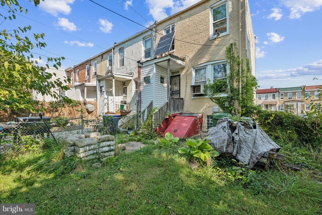 rear view of house with cooling unit