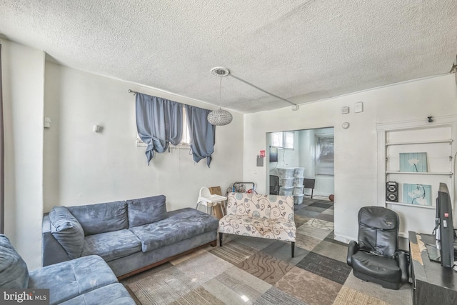 living room with a textured ceiling