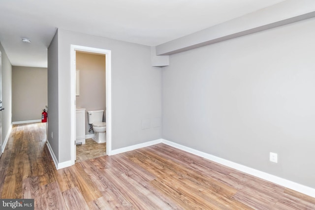 unfurnished room with light hardwood / wood-style flooring