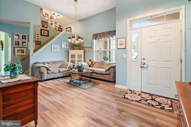 interior space with light hardwood / wood-style flooring and a chandelier