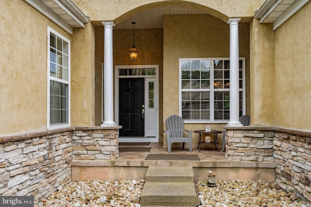 doorway to property featuring a porch