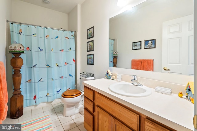 bathroom featuring tile patterned flooring, vanity, toilet, and a shower with shower curtain