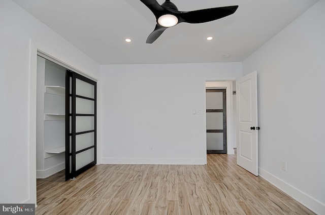 empty room featuring light hardwood / wood-style floors and ceiling fan